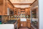 Kitchen with high end appliances and a traditional aesthetic